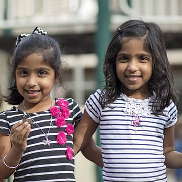 Two girls happy outside